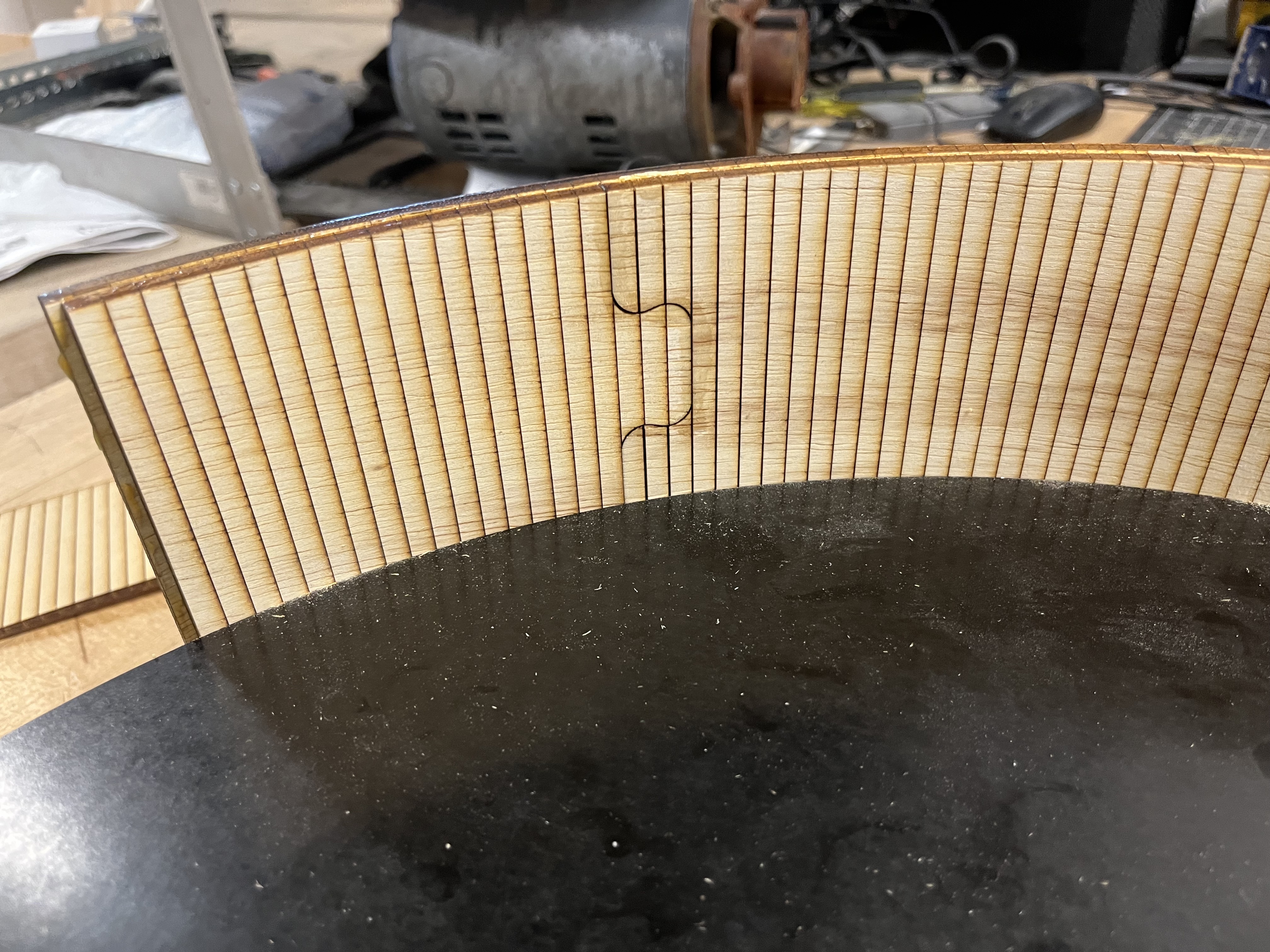 Laser scoring technique used to bend the plywood exterior