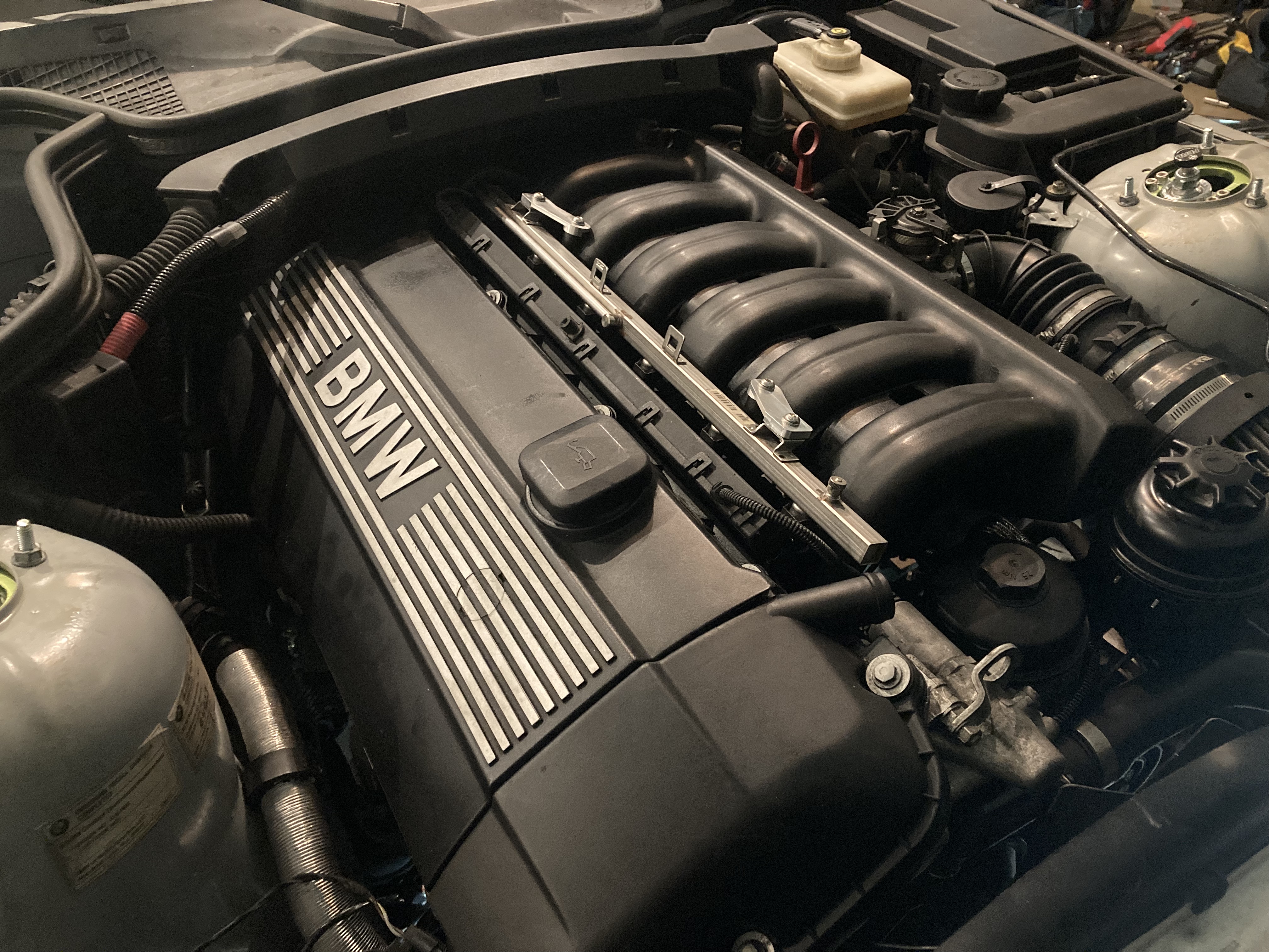 M54B30 sitting in the engine bay, fully installed